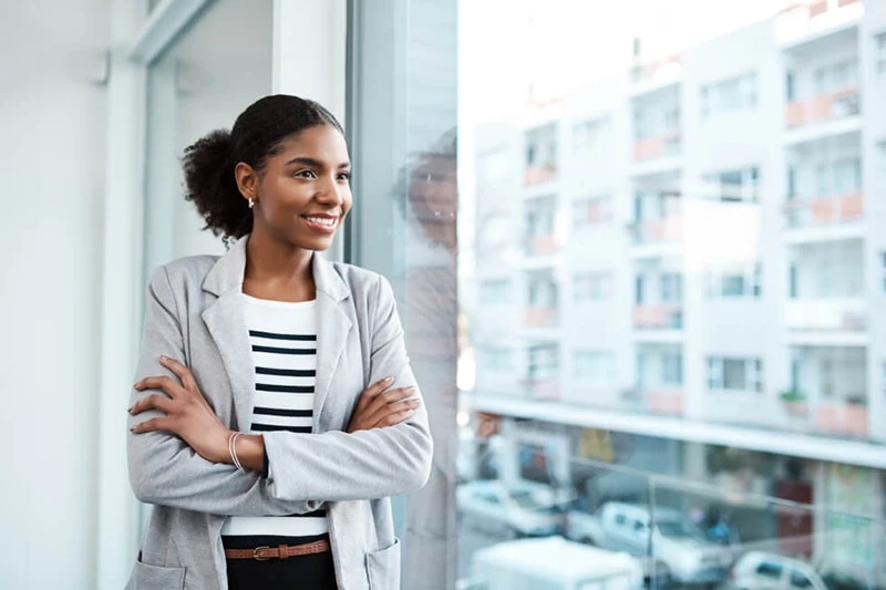 professional individual looking out an office window
